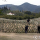 Illustration for article titled Chinese Farmers Build Birds Nest Stadium Out of Bamboo